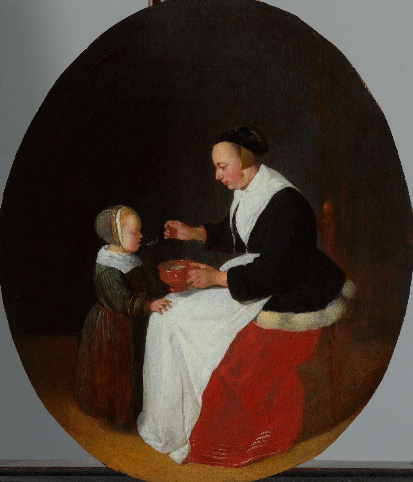 A Mother Feeding Porridge to her Child – Quiringh Gerritsz. van Brekelenkam Vintage Art Print | Wall Art Poster