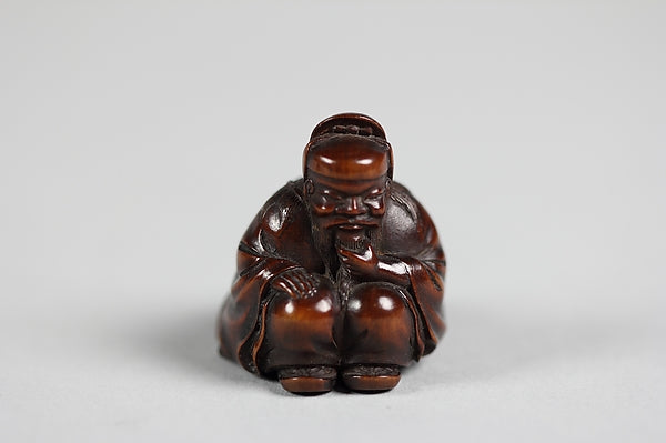 Netsuke of Seated Figure of an Old Man with Backpack Containin, Poster Print Wall Art