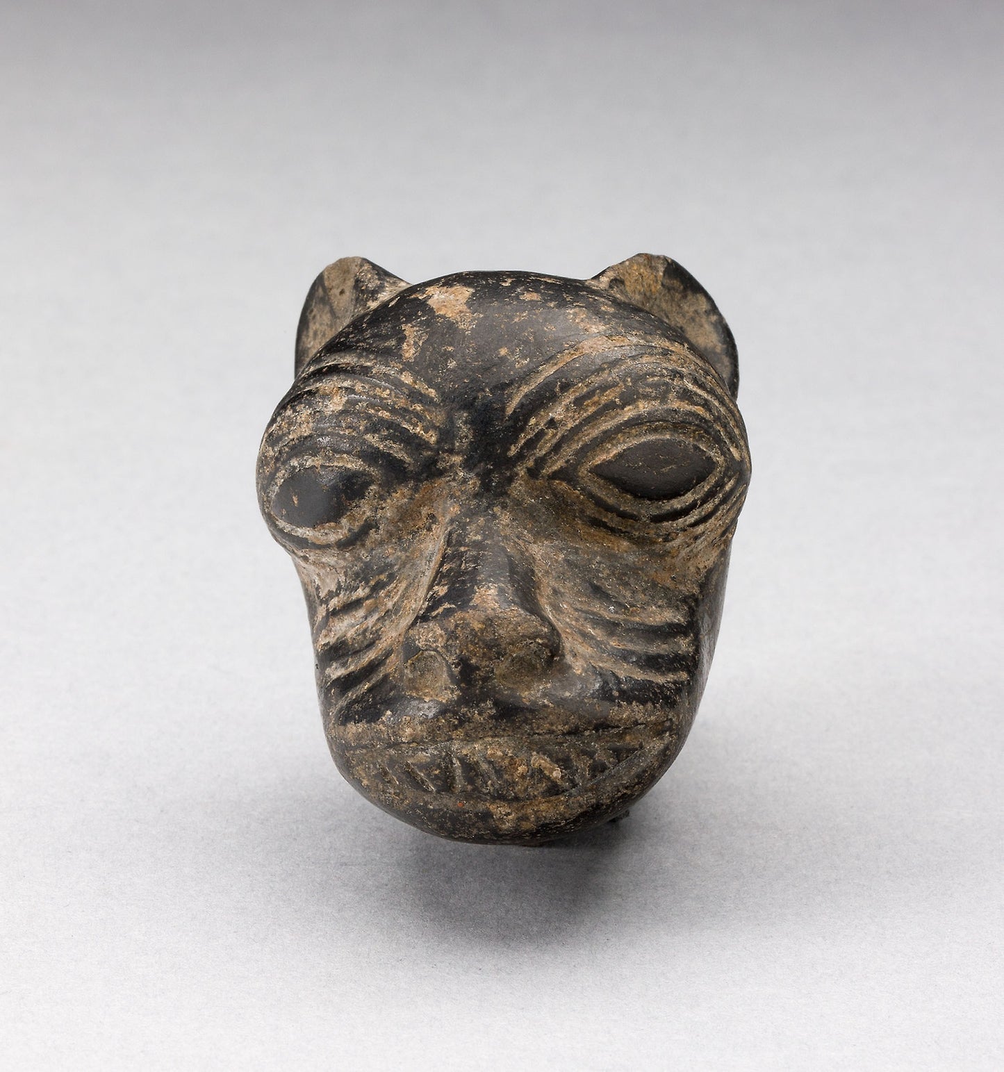 Fragment from a Blackware Vessel in the Form of a Puma Head - Chimú, Poster Print Wall Art