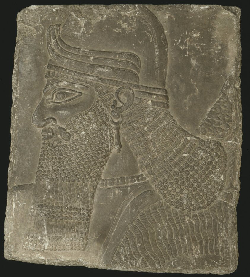 Relief Showing the Head of a Winged Genius by Mesopotamian, Assyrian, 23x16"( A2 size) Poster Print