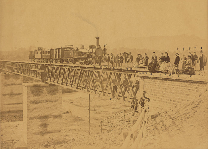 Altobelli & Molins:[Group portrait with train on bridge],16x12