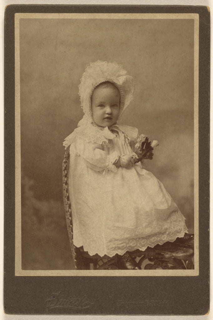 Smith:[Unidentified baby wearing a bonnet, holding a flower,,16x12"(A3)Poster