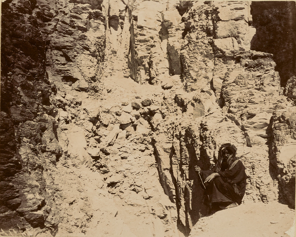 Unknown:[Man sitting at base of cliff wall], Poster Print Wall Art