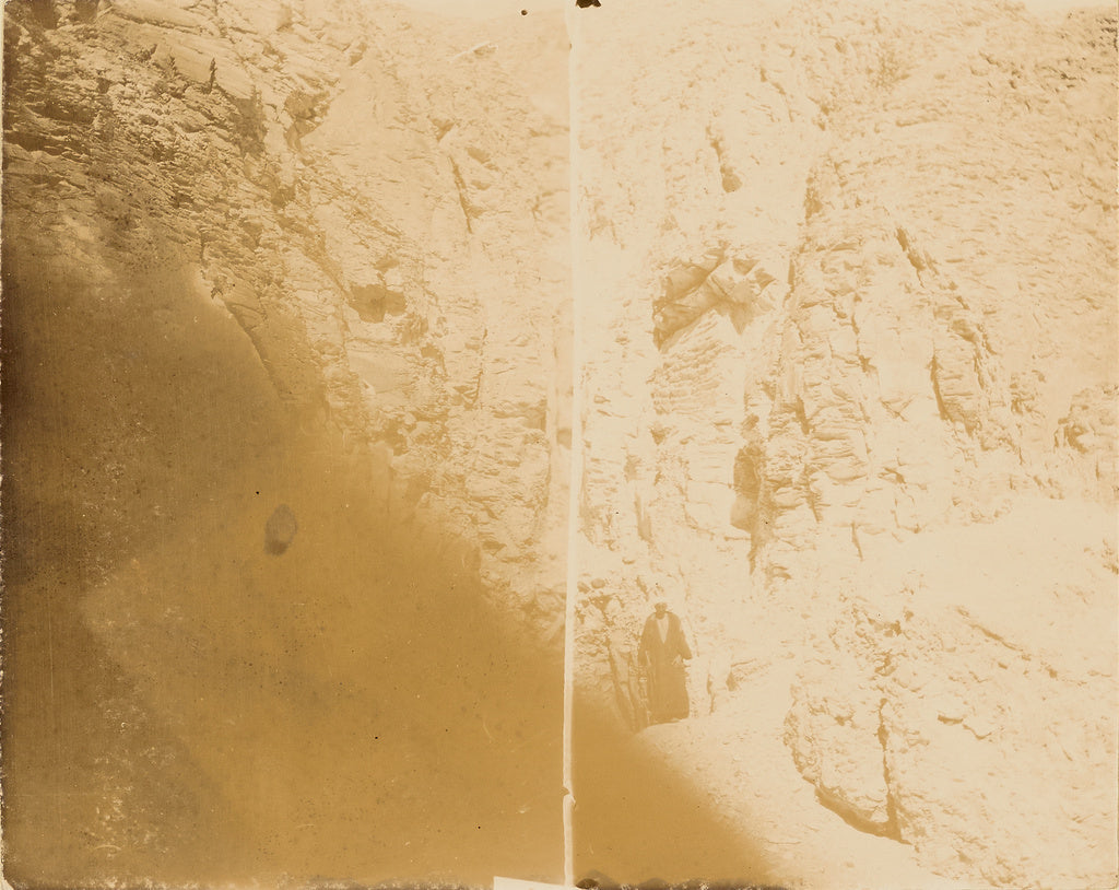 Unknown:[Man standing at base of cliff wall], Poster Print Wall Art