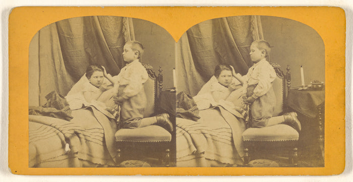 Unknown:[One child in bed, another kneeling in chair comfort,16x12