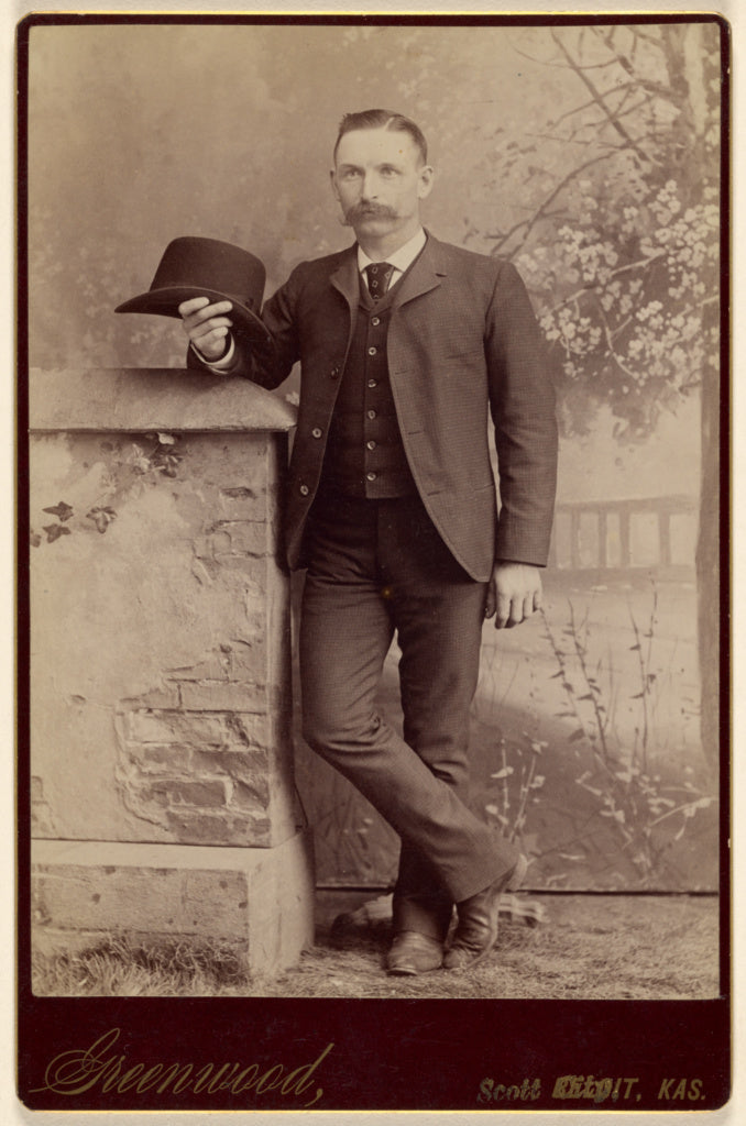 W.H. Greenwood:[Studio portrait of a man holding a hat],16x12
