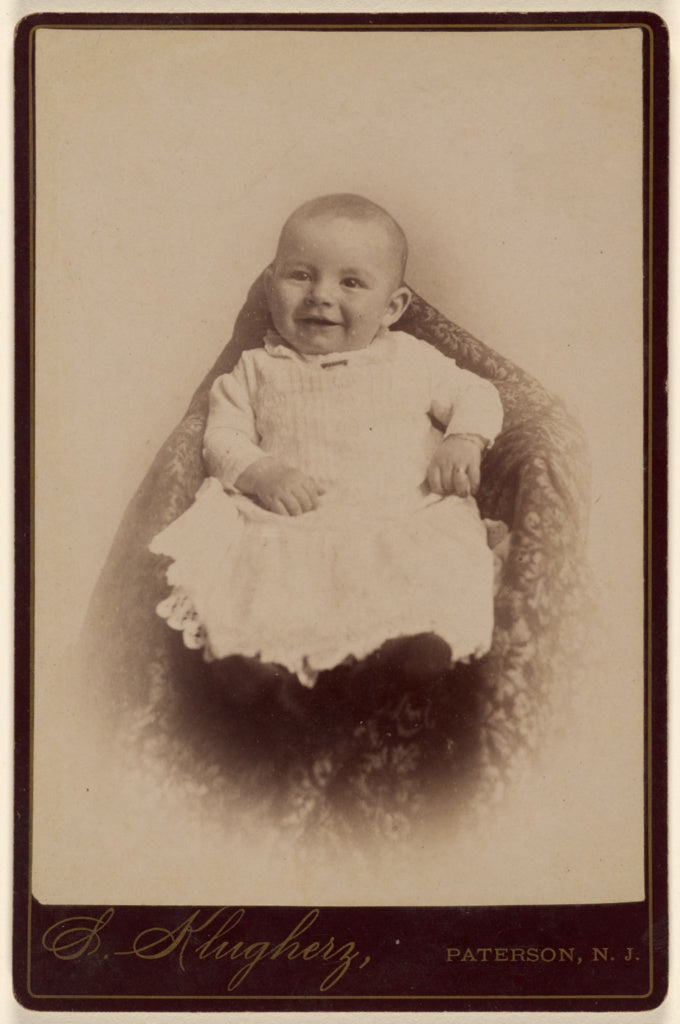 S. Klugherz:[Baby on a cushion], Poster Print Wall Art
