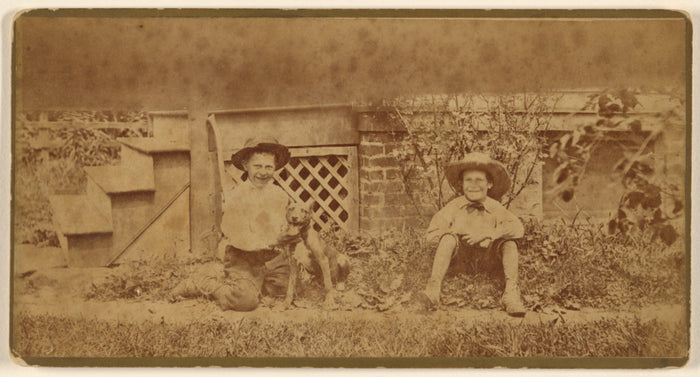Unknown:[Two boys seated on ground with a dog],16x12