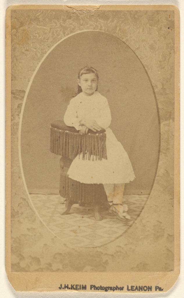 J.H. Keim:[Unidentified little girl posed on chair with tass,16x12