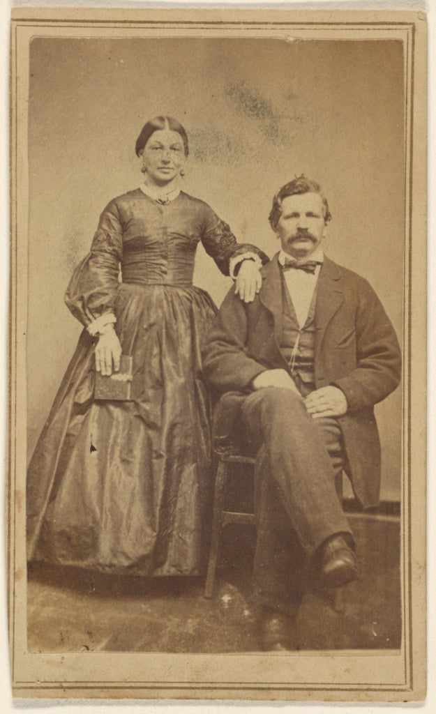 J.W. Smith:[Unidentified couple: woman standing holding a bo,16x12
