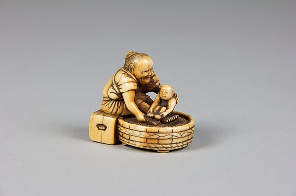 Netsuke of Old Woman Bathing Child in a Tub 18th–19th cent,  Poster Print