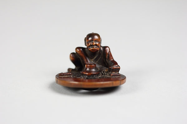 Netsuke of a Wheel Maker 19th cent,  Poster Print Wall Art