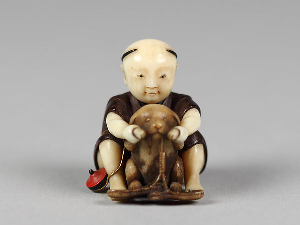 Netsuke of Boy Playing with a Dog 19th cent,  Poster Print