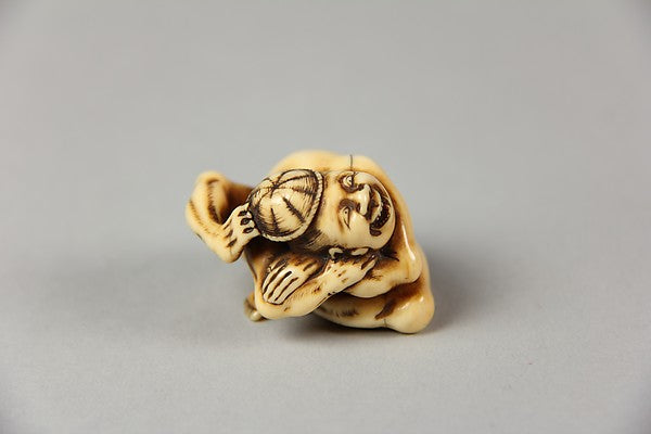 Netsuke of Acrobat Removing his Hat with His Foot 19th cent,  Poster Print