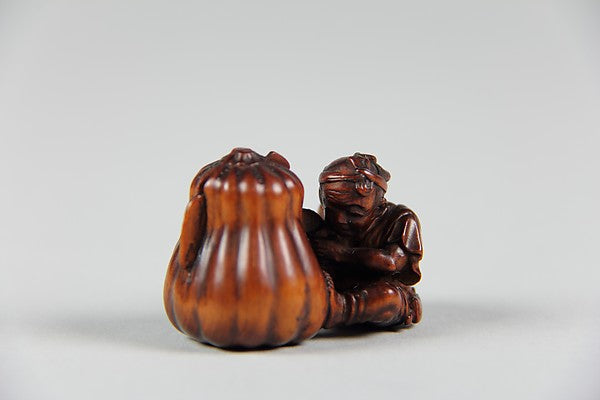 Netsuke of Boy Cutting a Gourd 19th cent,  Poster Print Wall Art