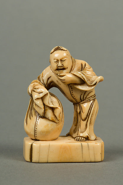 Netsuke of Man with a Bag Standing on a Block 19th cent,  Poster Print