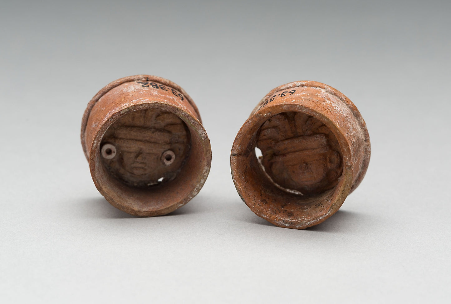 Pair of Ear Plugs with Face of Figure in Interior -  Teotihuacan,  Poster Print Wall Art