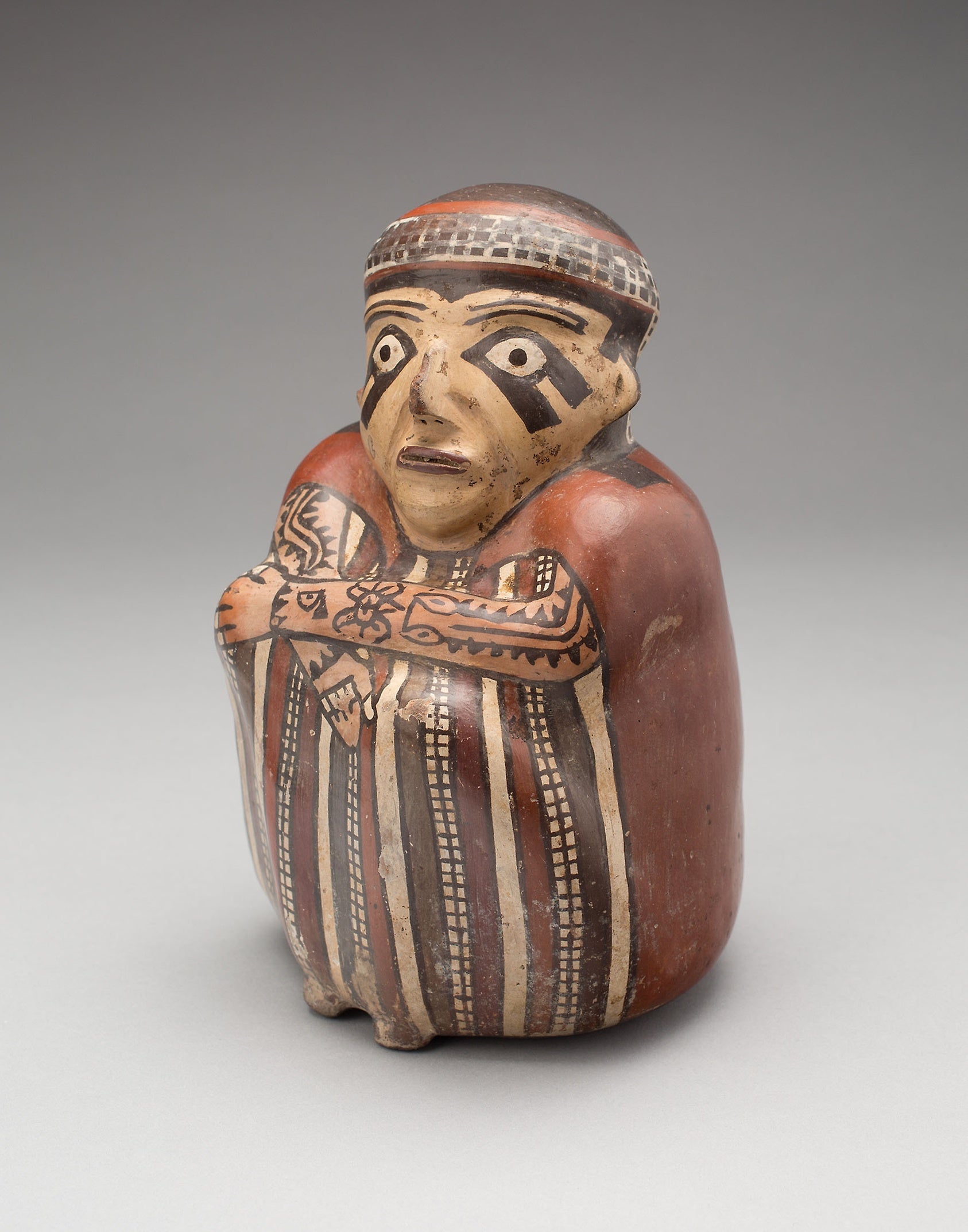 Vessel in the Form of a Seated Figure with Tattooed Arms: Nazca,16x12"(A3) Poster