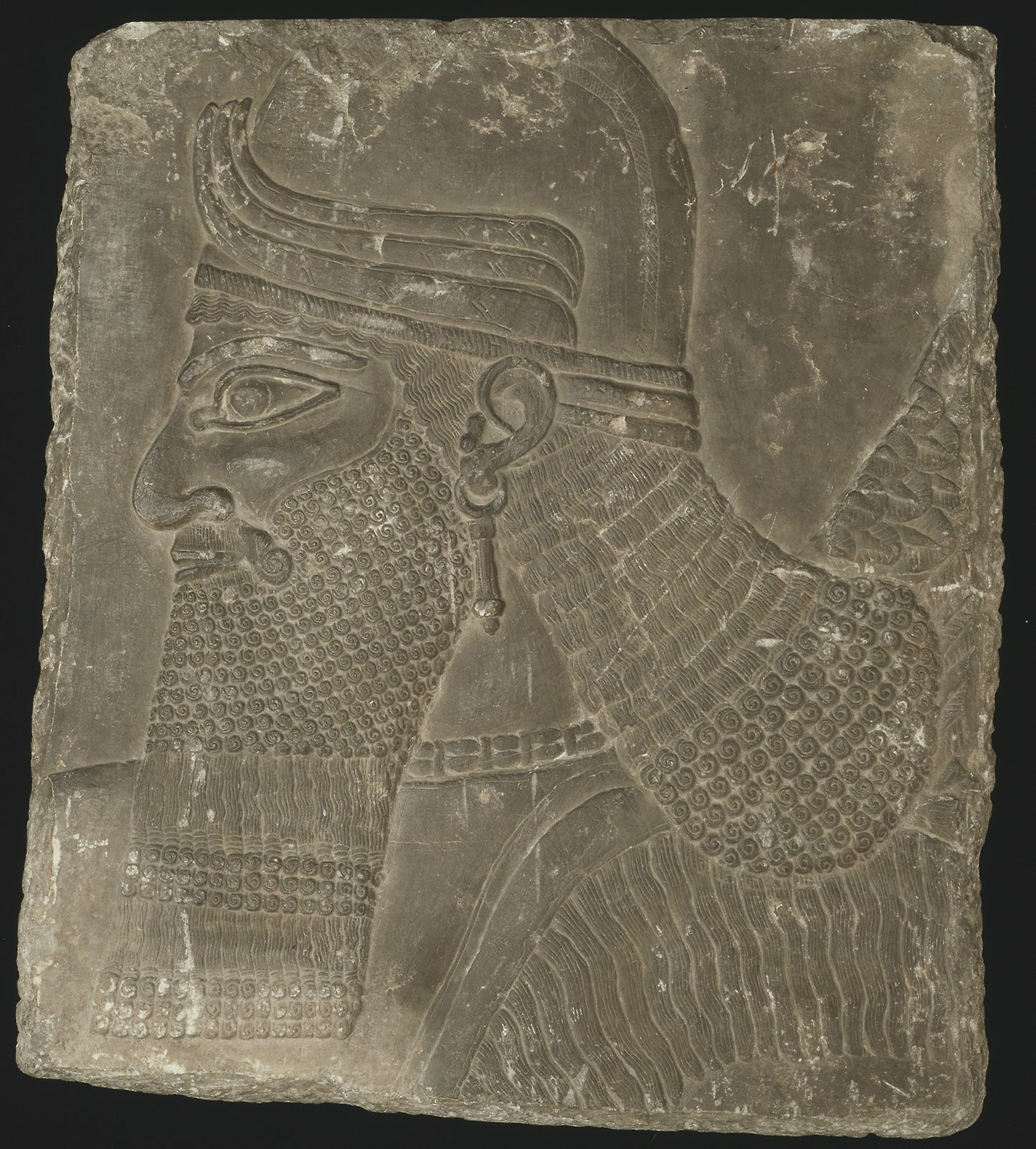 Relief Showing the Head of a Winged Genius -  Mesopotamian, Assyrian,  Poster Print Wall Art