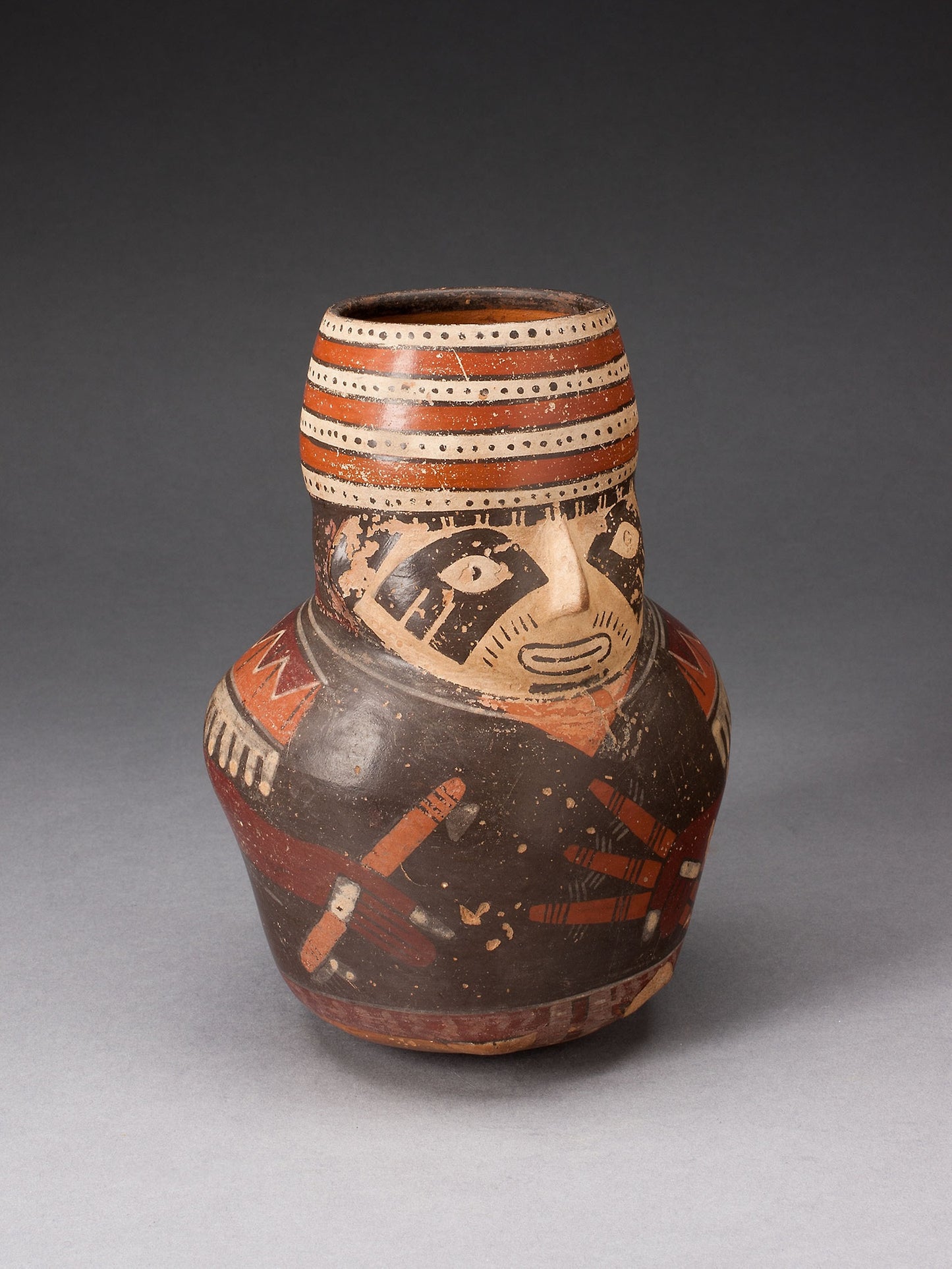 Jar in the Form of a Warrior Holding a Club and Other Weapons -  Nazca,  Poster Print Wall Art