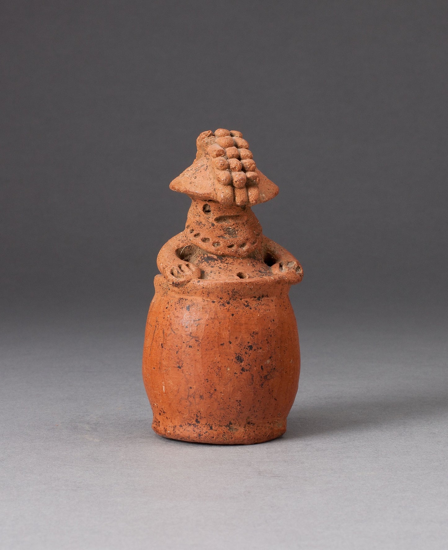 Miniature Rattle in the Form of a Figure Wearing Headdress and Mask -  Possibly Guacimo,  Poster Print Wall Art