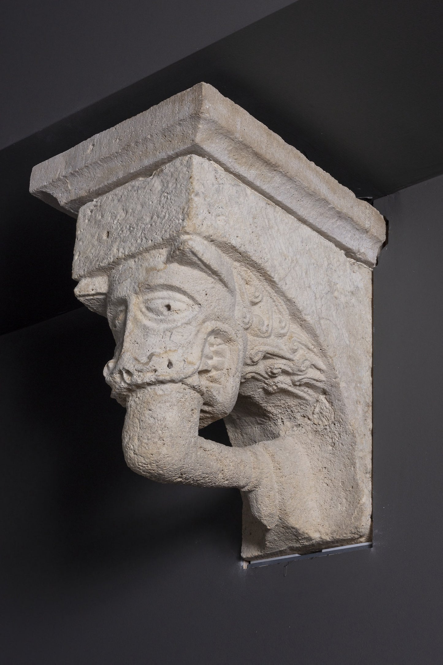 Corbel with Animal Mask with Teeth Fastened on Human Leg from the Monastery Church of Notre-Dame-de-la-Grande-Sauve -  French, Aquitaine,  Poster Print Wall Art