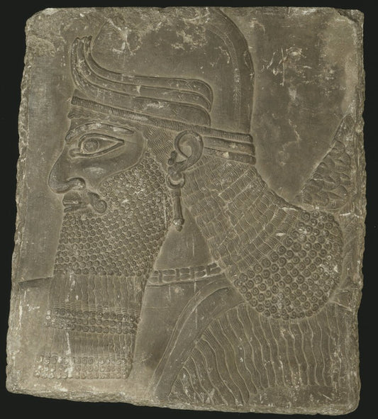 Relief Showing the Head of a Winged Genius by  Mesopotamian, Assyrian, 23x16"( A2 size) Poster Print