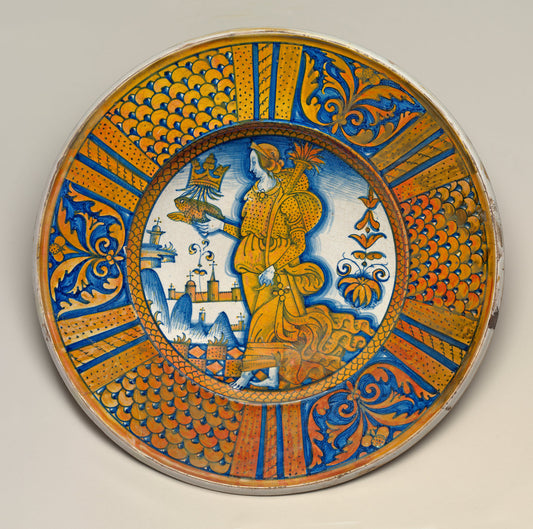 Large dish with segmental border of plant sprays and scale pattern; in the center, an emblematic female figure holding a crowned toad and cornucopia by Deruta 16th Century (Deruta, 16th century), 16X12"(A3)Poster Print