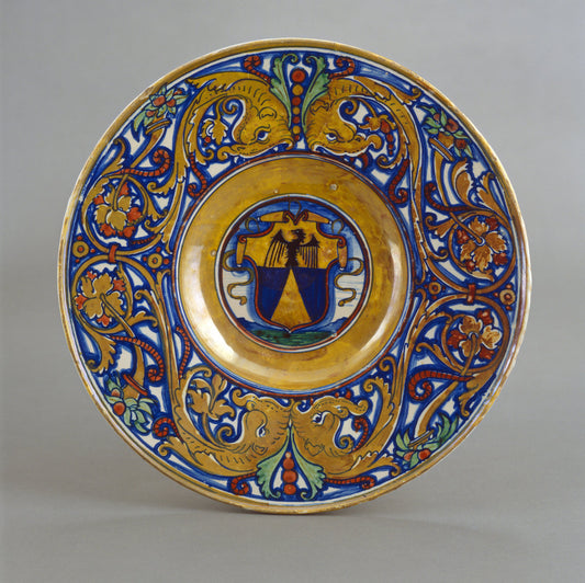 1524 by Workshop of Maestro Giorgio Andreoli of Gubbio (Plate with border of foliate scrollwork with dolphin heads and cornucopias; in the center, shield of arms of Vigerio of Savona), 16X12"(A3)Poster Print